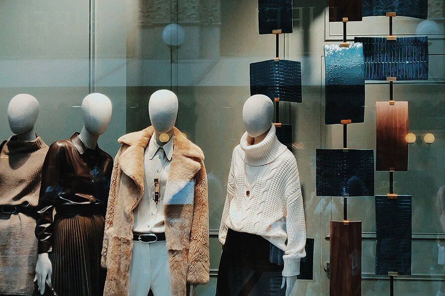 A window display showing clothed mannequins