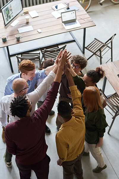 staff members high fiving each other